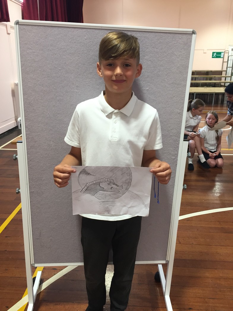 Andrew with his amazing drawing of a dragon